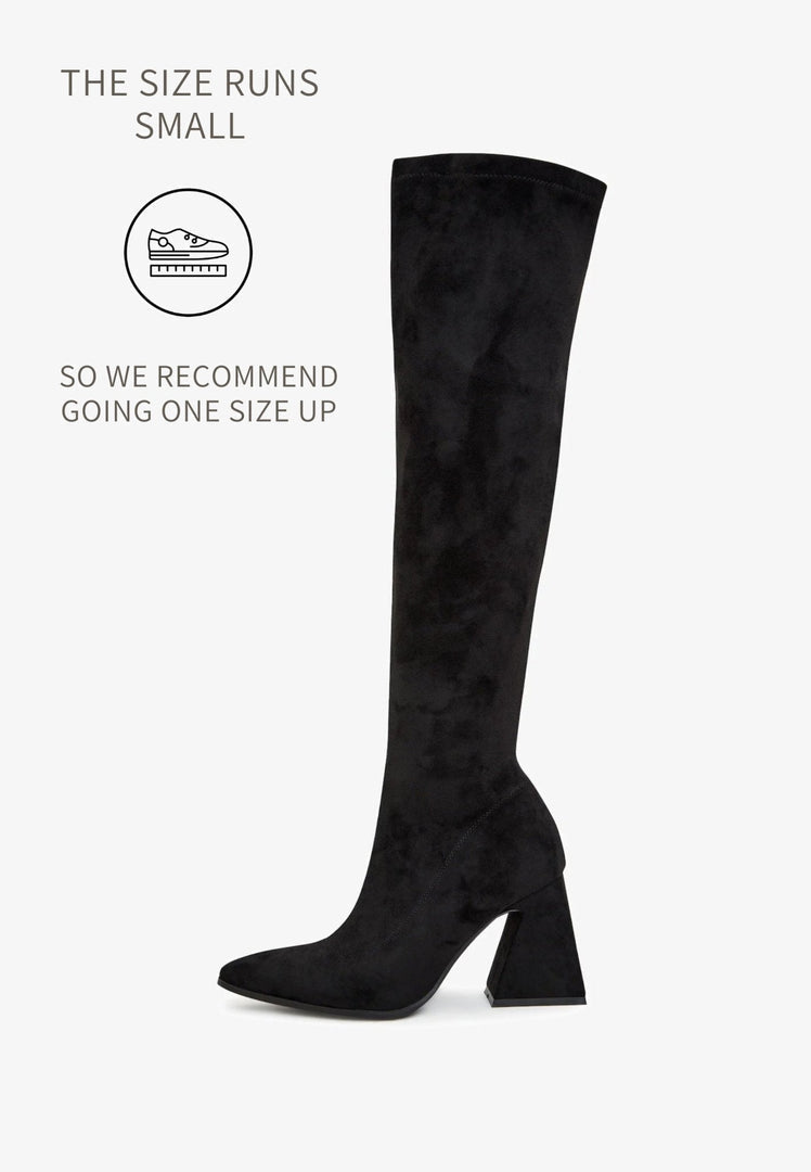 A pair of designer thigh-high boots crafted from high-end suede, representing luxury women's boots as premium over-the-knee footwear, exclusive in style and quality.