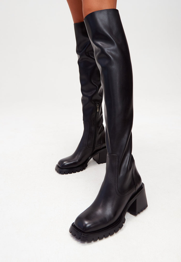 A stylish pair of black leather over-the-knee high-heel boots for fashionable women.