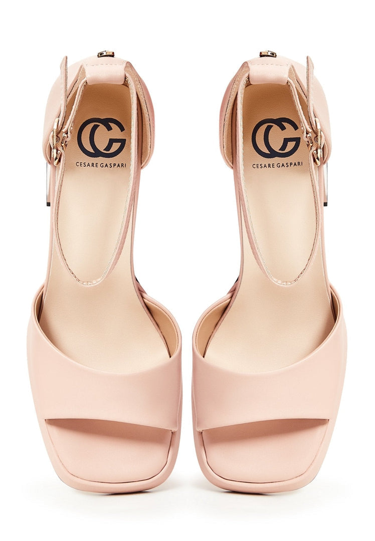 A stylish pair of beige open toe high heel sandals, perfect for any classic outfit.