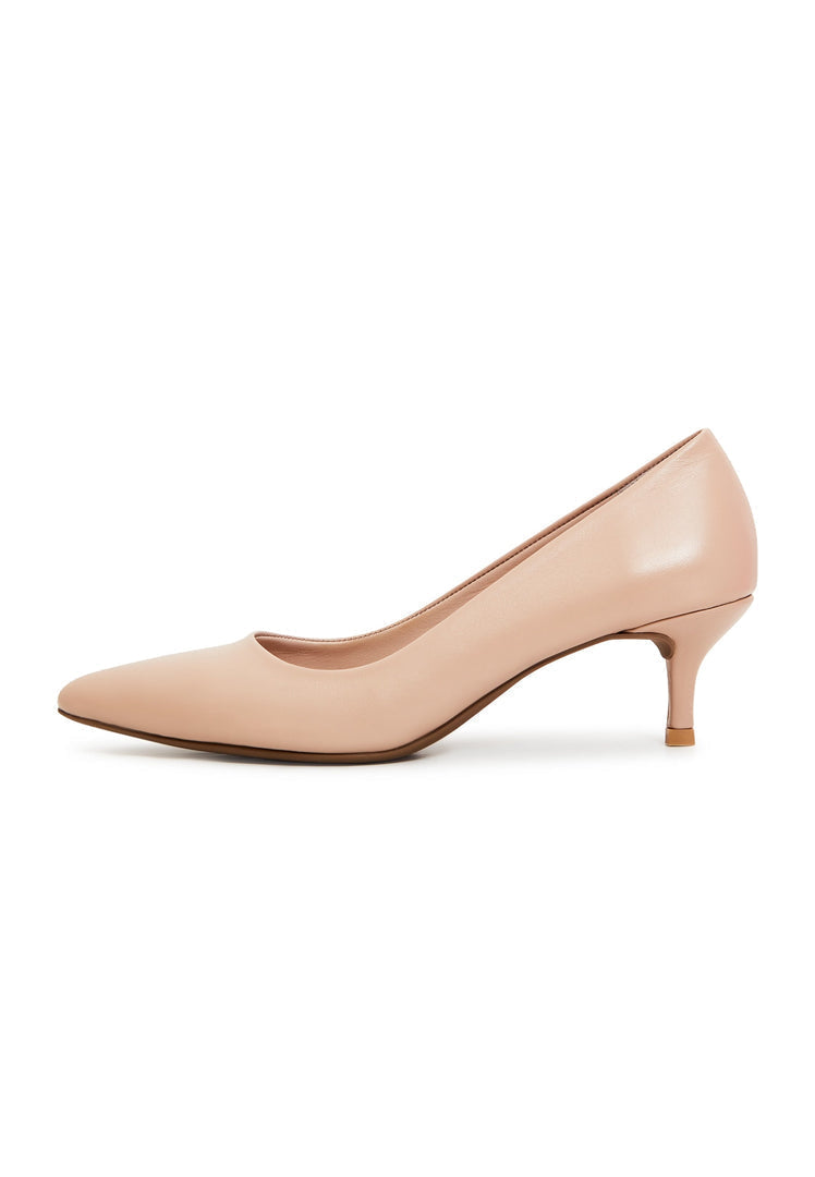 A pair of elegant beige pumps, luxe designer heels for a fashionable look.