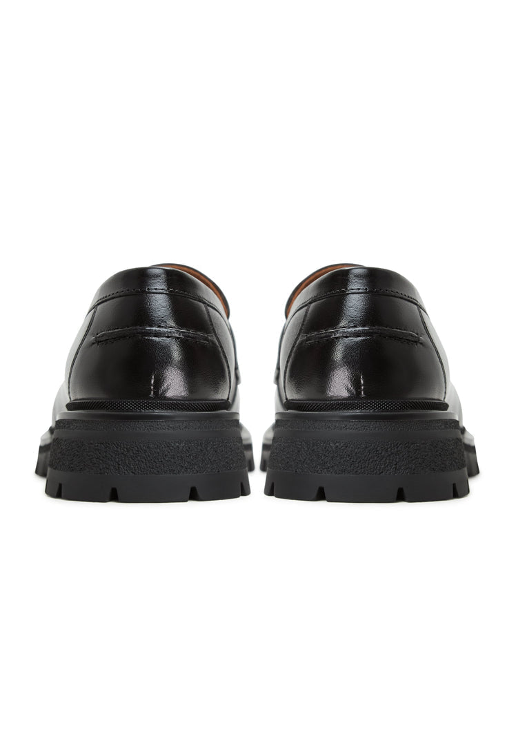 A stylish pair of Mariana black leather loafers with platform soles for women's footwear.