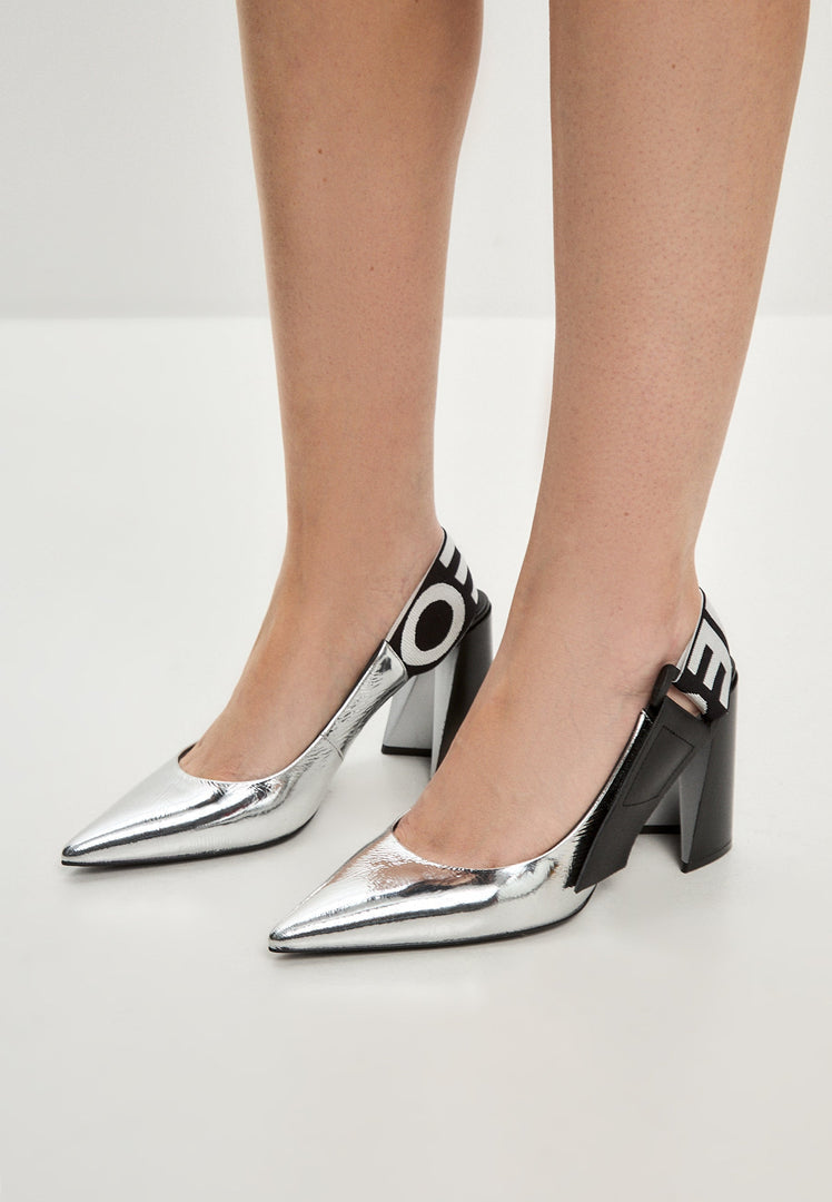 A fashionable pair of silver block heeled pumps with slingback style, known as the Jimena pumps, perfect for women's footwear needs.