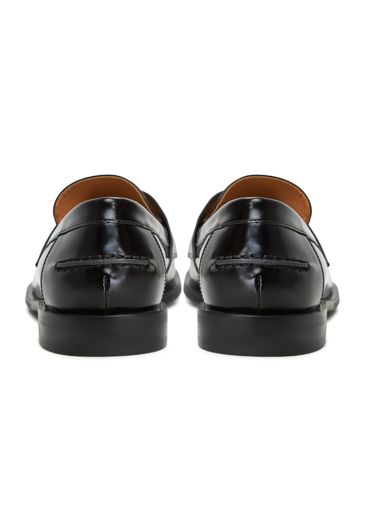 A stylish pair of women's patent black loafers featuring leather block heels, perfect for any occasion.