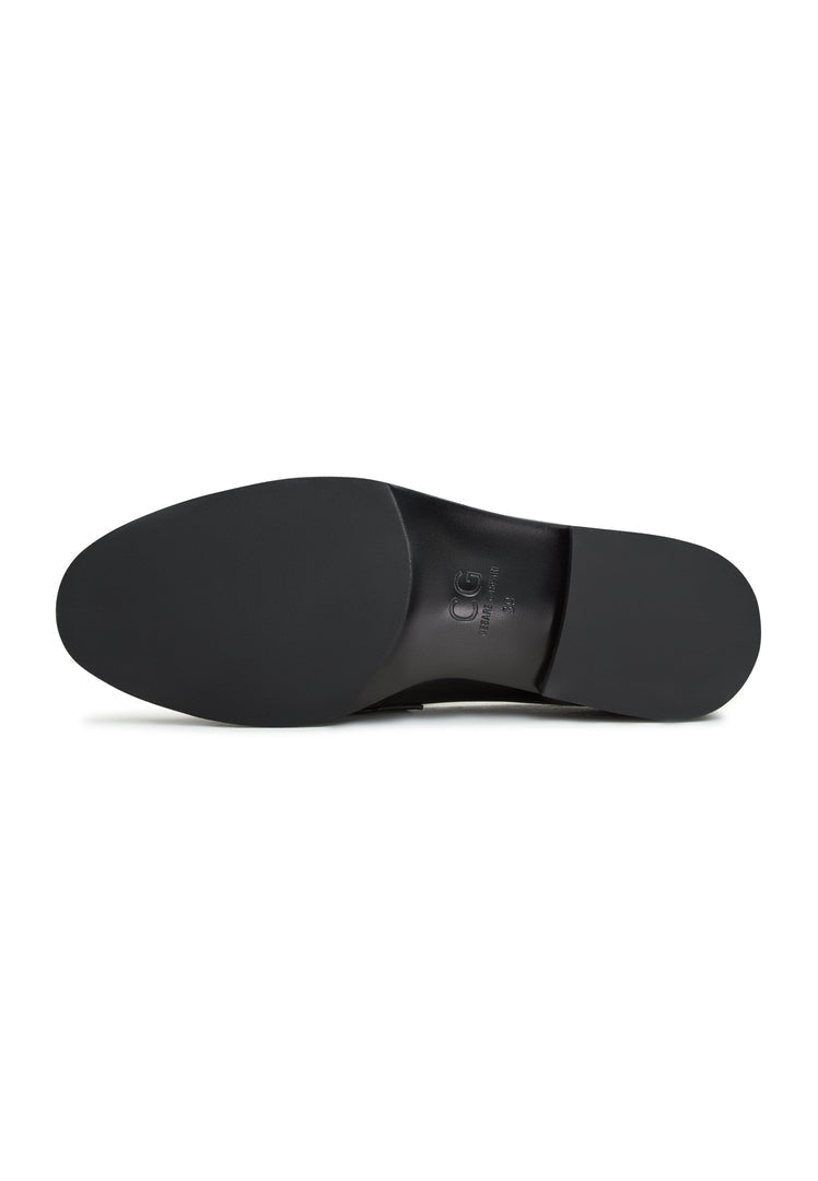 A stylish pair of women's patent black loafers with leather block heels, the perfect combination of comfort and sophistication.