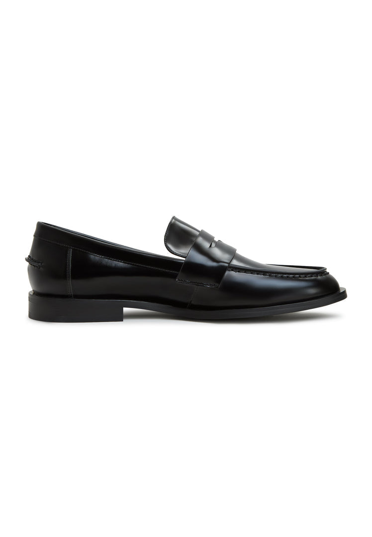A fashionable pair of black patent leather block heeled loafers, perfect for women who love stylish and comfortable footwear.