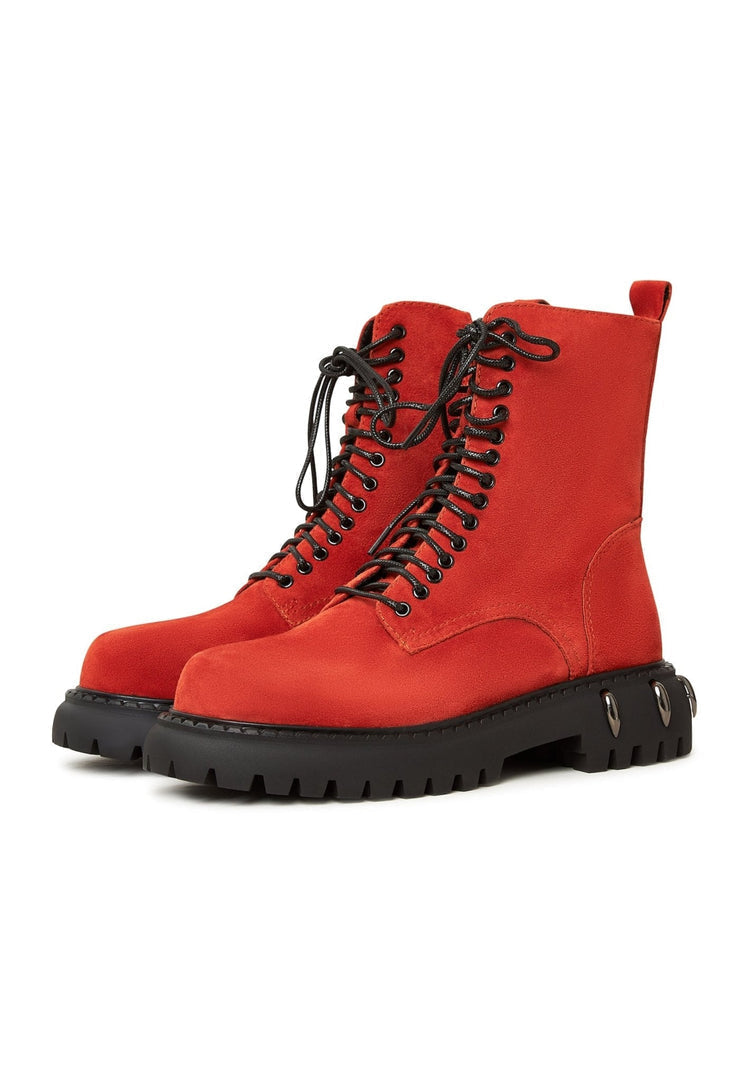 A pair of trendy red lace-up combat boots with a chunky sole, perfect for women's fashion.