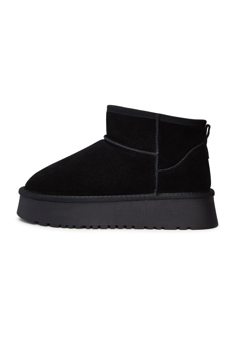A stylish pair of black suede platform boots - perfect for the winter season and trendy fashion enthusiasts.