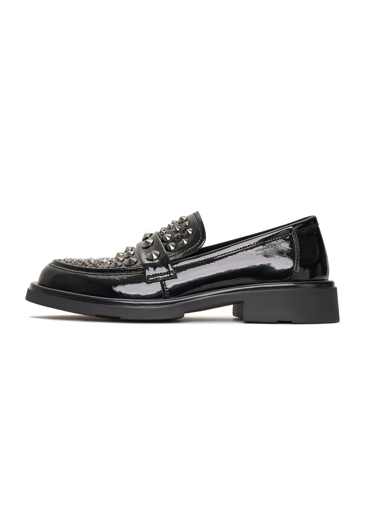 A pair of rockstar-inspired black leather loafers, perfect for men's fashion footwear, showcasing stylish loafers.