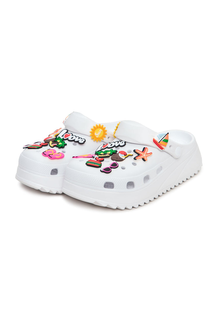 A woman wearing stylish CESARE GASPARI Clogs smiling, showcasing the comfort and style of these popular shoes in this CESARE GASPARI Clogs review image.