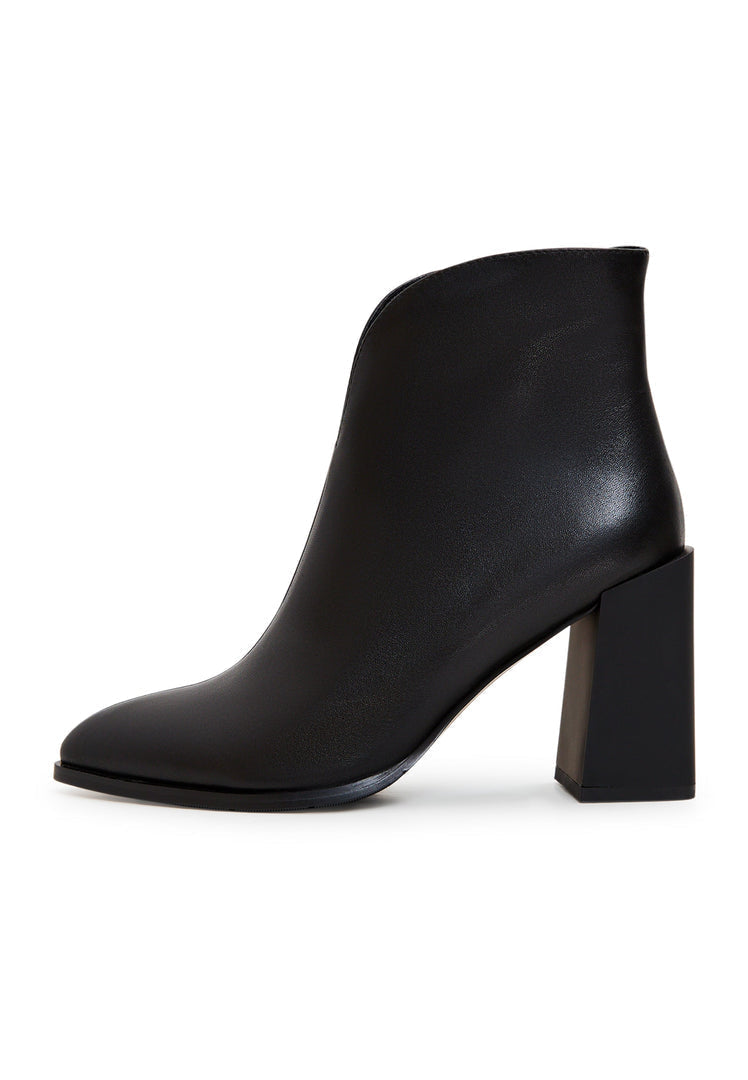 A stylish pair of leather ankle boots with block heels in classic black, perfect for any outfit. Trendy and fashionable women's ankle boots for a chic look.
