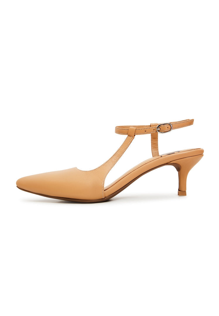 A pair of elegant beige designer heels, luxe shoes that are fashionable stilettos.