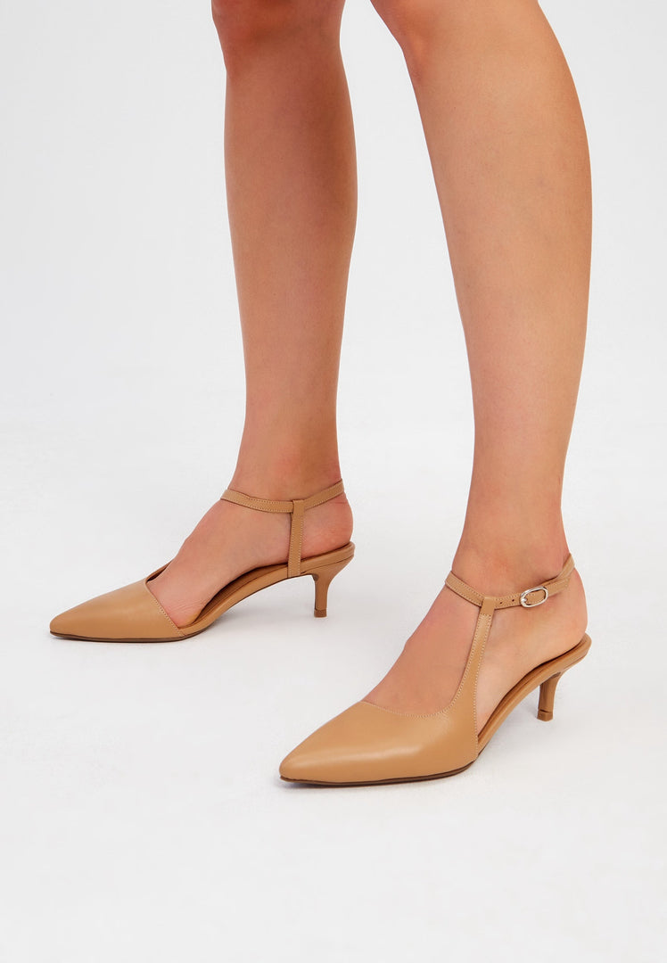 A pair of elegant beige designer heels, a staple in luxe shoes fashion - perfect for any upscale occasion.
