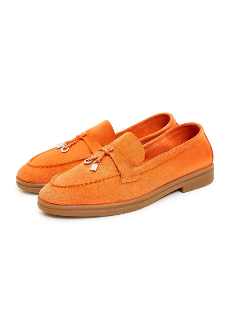 A pair of men's classic loafers with a flat sole in trendy orange color, perfect for fashion-forward footwear.