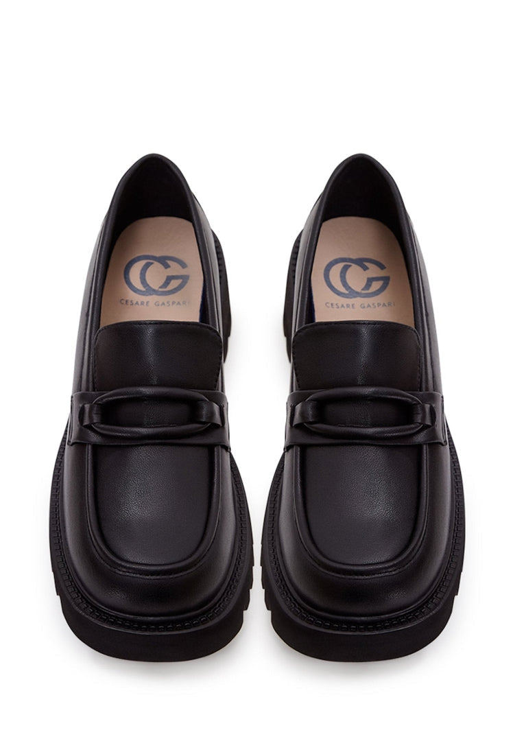 A stylish collection of women's shoes including leather loafers, classic black heels, block heel shoes, and black leather loafers for women.