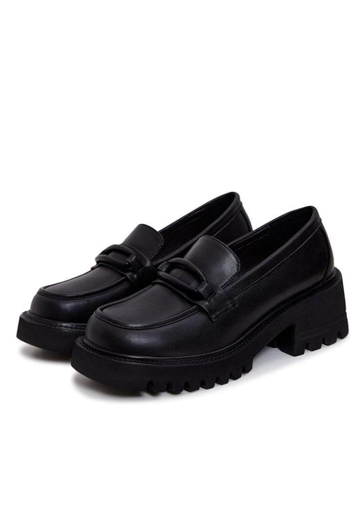 A stylish image featuring a variety of footwear including leather loafers, classic black heels, block heel shoes, and black leather shoes, perfect for women's fashion.