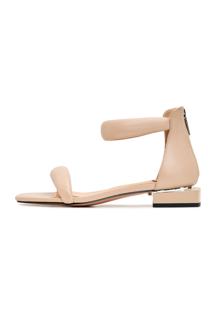 A stylish pair of beige block heel sandals named Sofia, perfect for adding a touch of elegance to any outfit.