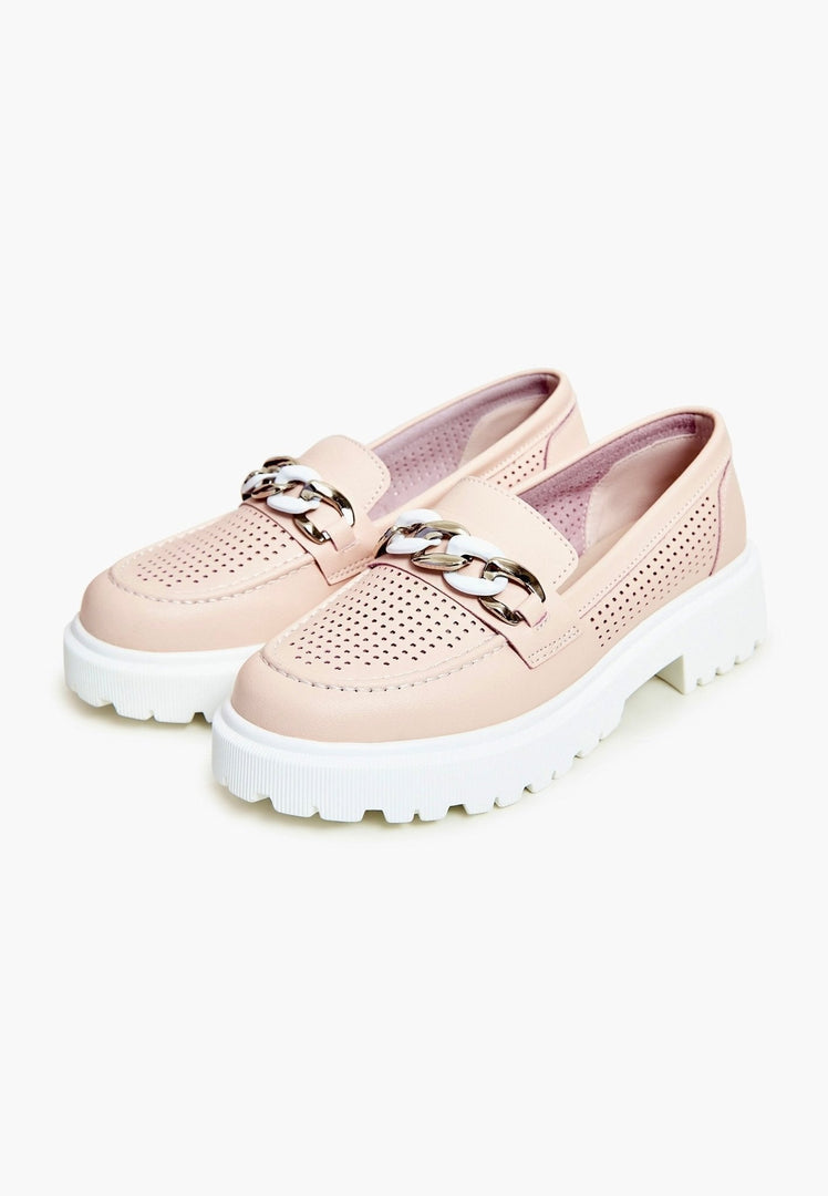 A pair of stylish and comfortable pink casual loafers for women, perfect for adding a pop of color to your outfit.