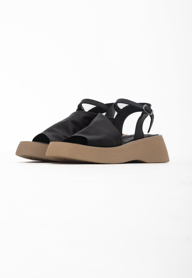 A trendy pair of casual black platform sandals for women, combining style with comfort.