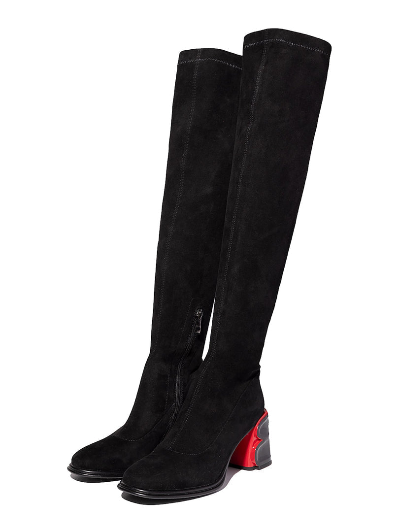 A stylish pair of black suede shoes, showcasing the latest trend in sophisticated suede fashion.
