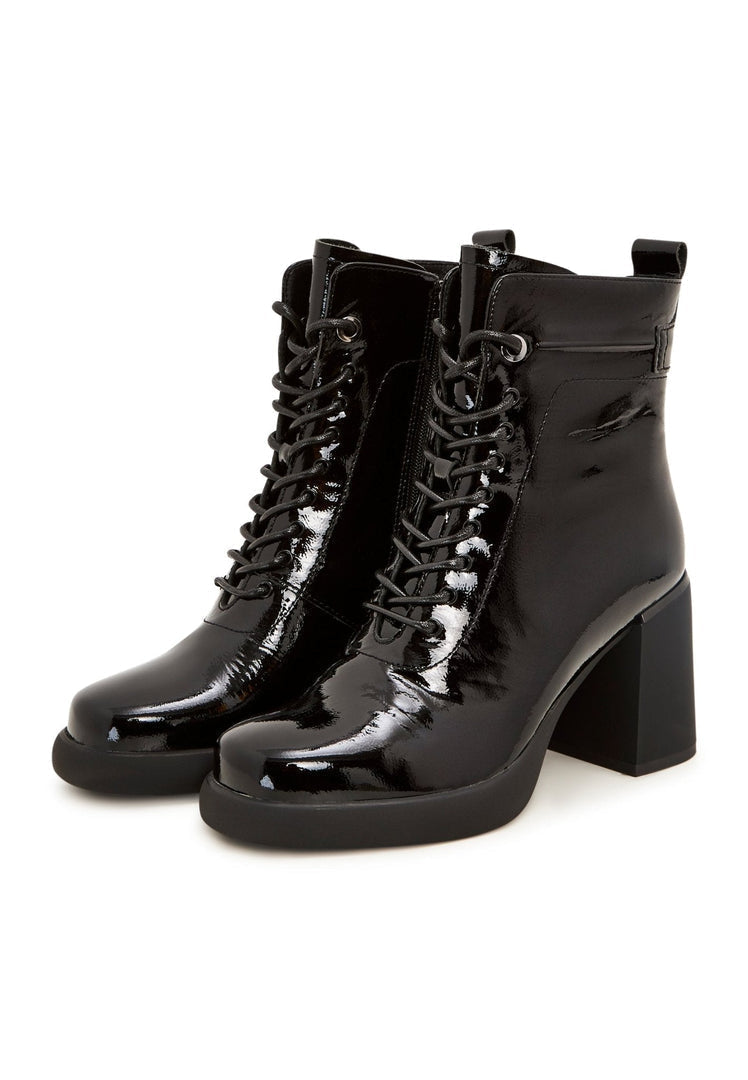 A stylish pair of black high heeled ankle boots, the perfect classic and fashionable choice for women's footwear.