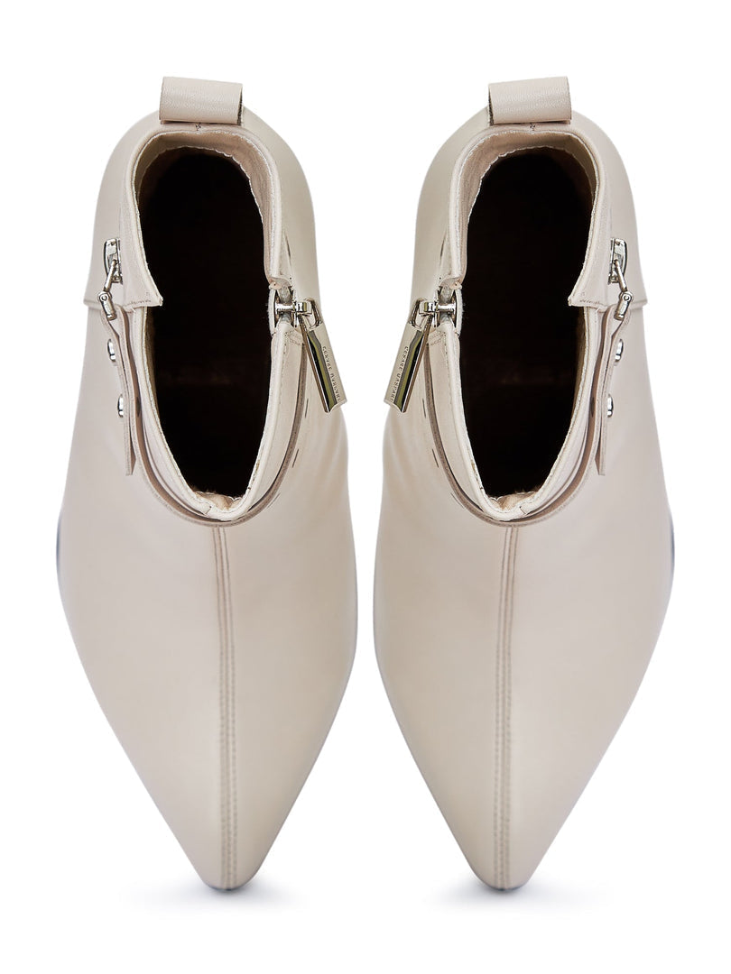 A trendy pair of high-heeled leather ankle boots, perfect for any fashionable woman's wardrobe.