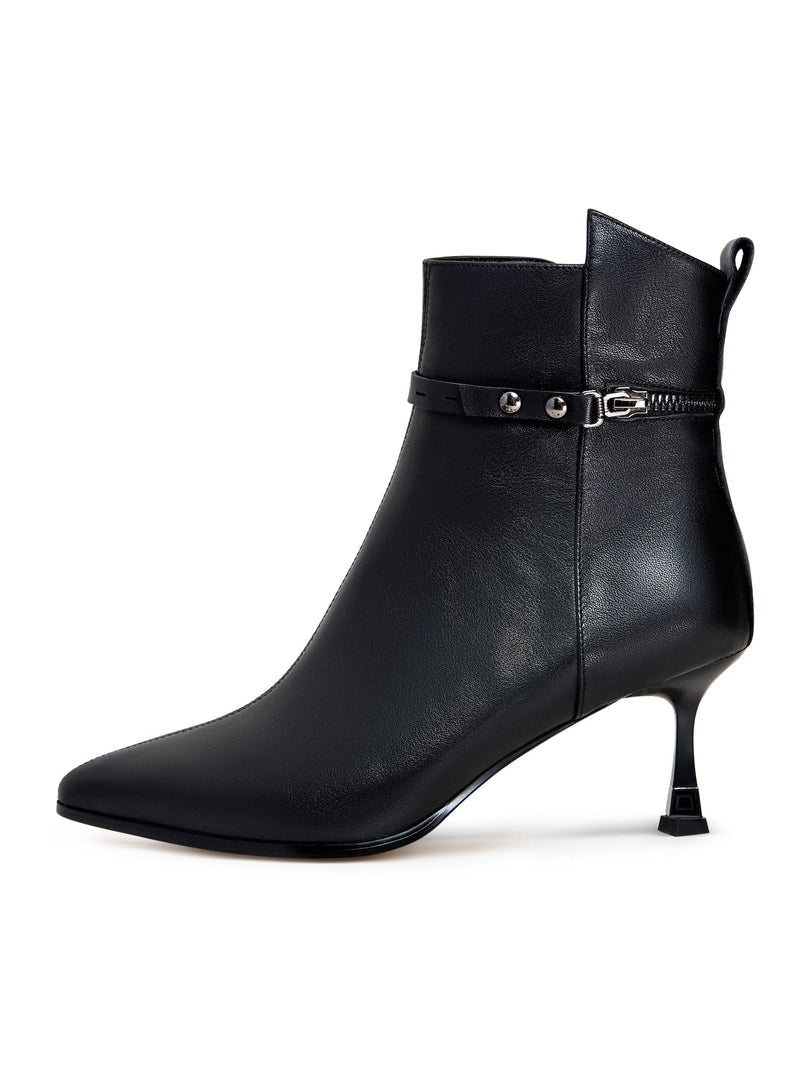 A pair of fashionable high-heeled leather ankle boots for women, featuring stylish leather booties perfect for any trendy look.