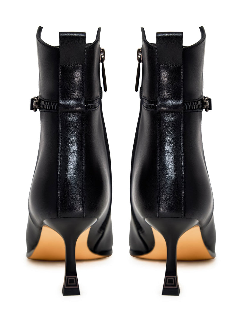 A stylish pair of high-heeled leather ankle boots for women, perfect for a fashionable look with these leather booties.