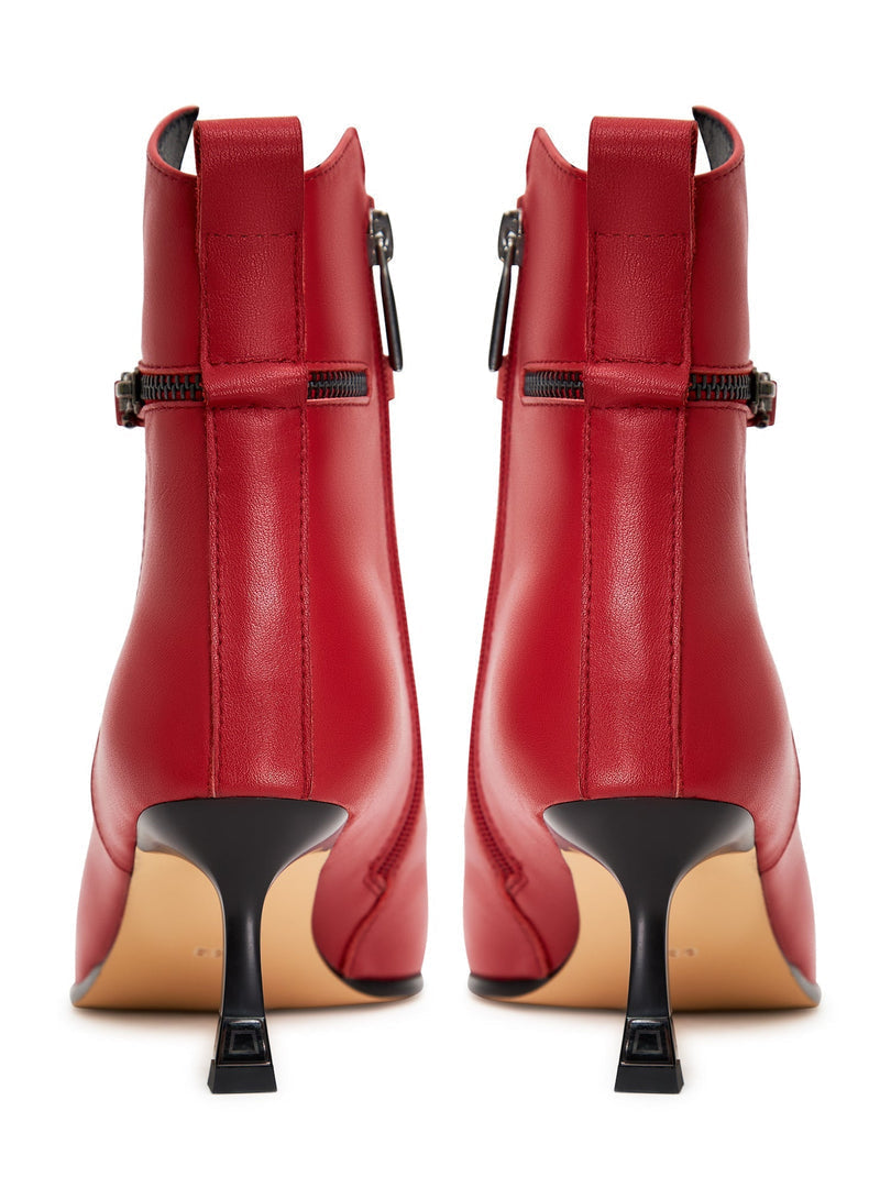 A stylish pair of high-heeled leather ankle boots, perfect for any fashion-forward woman's wardrobe.