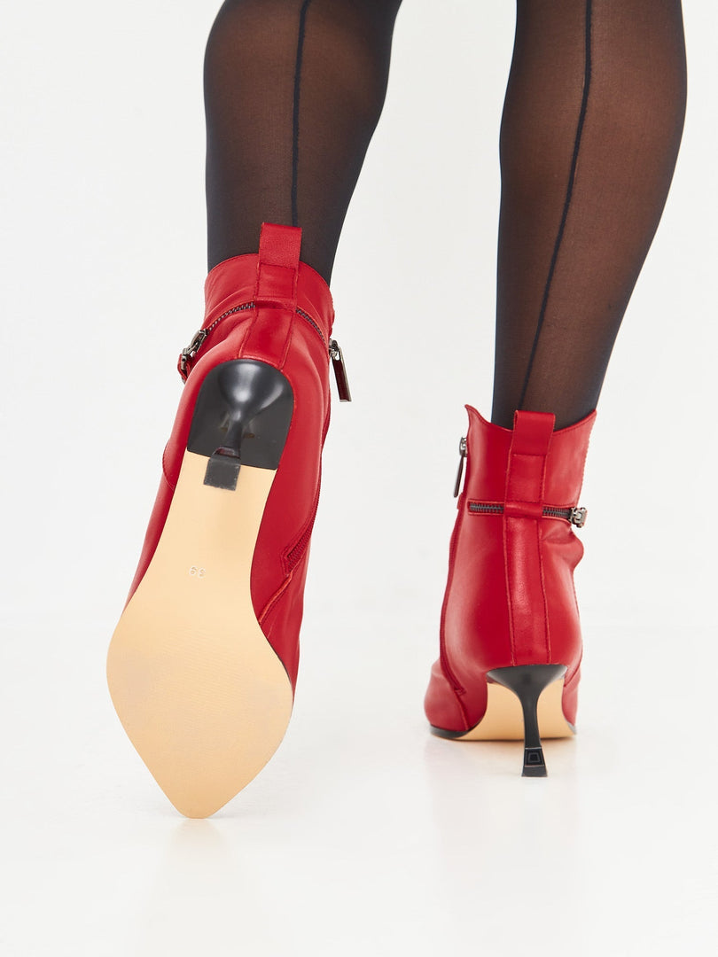 A chic pair of high-heeled leather ankle boots, perfect for any stylish woman looking for fashionable and trendy leather booties.