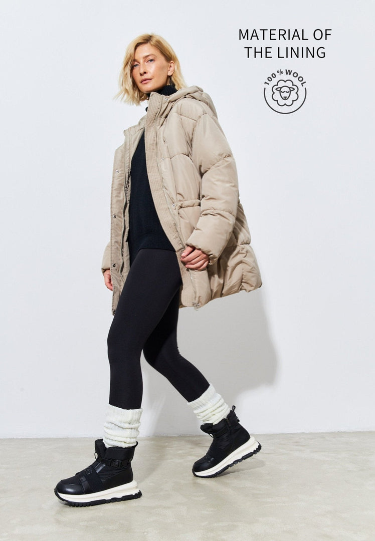 A trendy pair of black ankle sneaker boots, perfect for winter, featuring a stylish and fashionable design ideal for winter footwear.