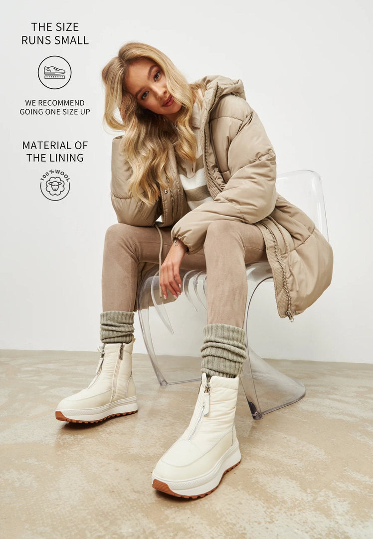 A stylish pair of women's winter platform boots in warm ivory, perfect for staying cozy and fashionable in the cold weather.