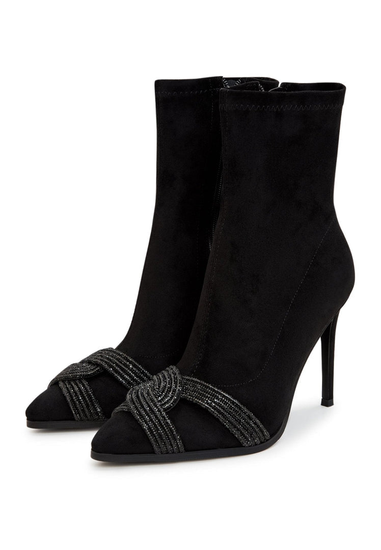 A pair of stylish suede ankle booties, a must-have for any chic and trendy footwear collection.