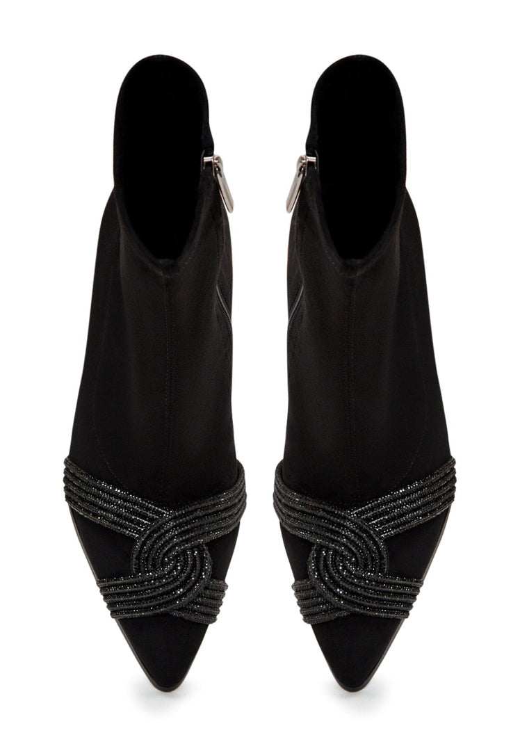 A pair of stylish suede ankle booties, perfect for a chic and trendy fashion statement.