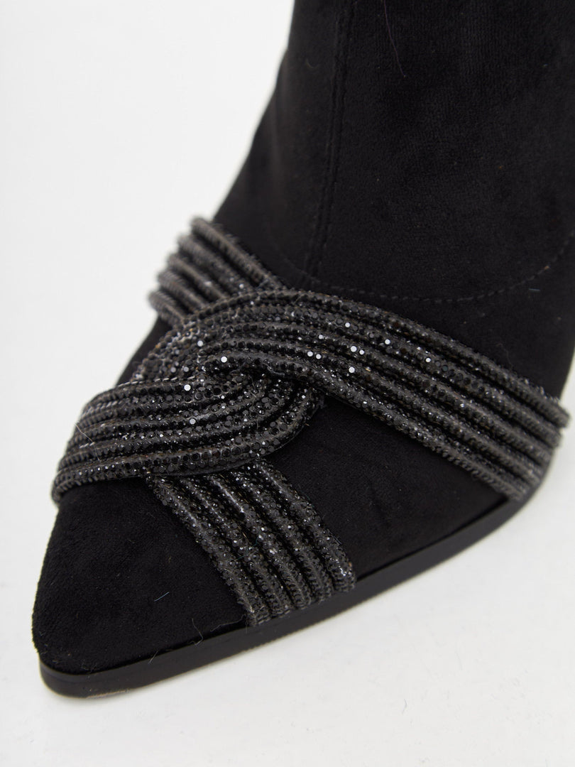Stay on trend with these stylish suede ankle booties, the perfect chic and fashion-forward footwear choice.