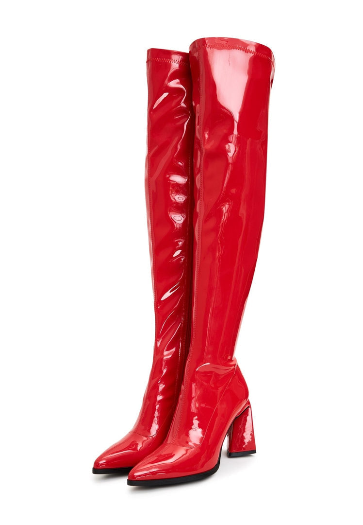 A stylish woman wearing fashionable red over the knee boots - chic comfort footwear for women in red.