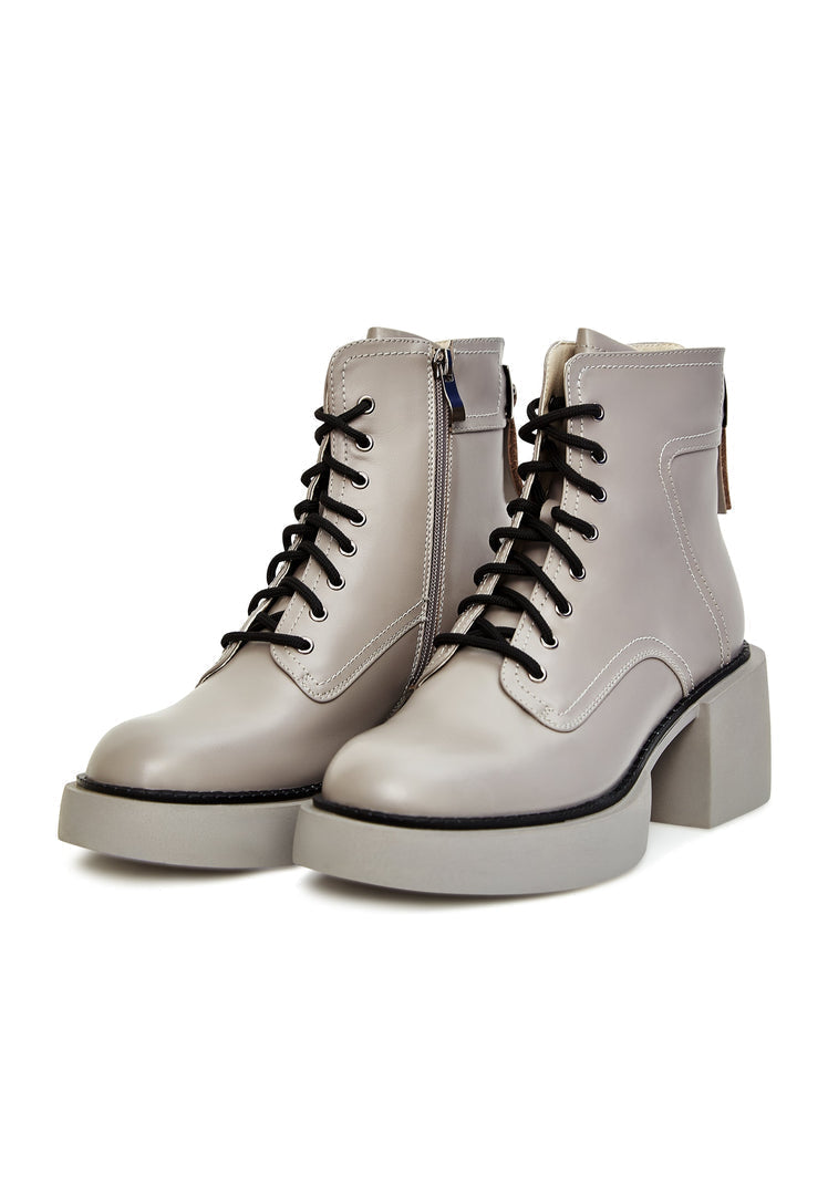 A pair of chic grey ankle boots, a fashionable and stylish choice for women's footwear.