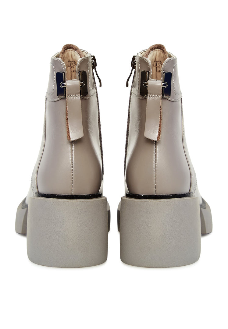 A stylish pair of women's chic grey ankle boots, perfect for adding a fashionable touch to any outfit.