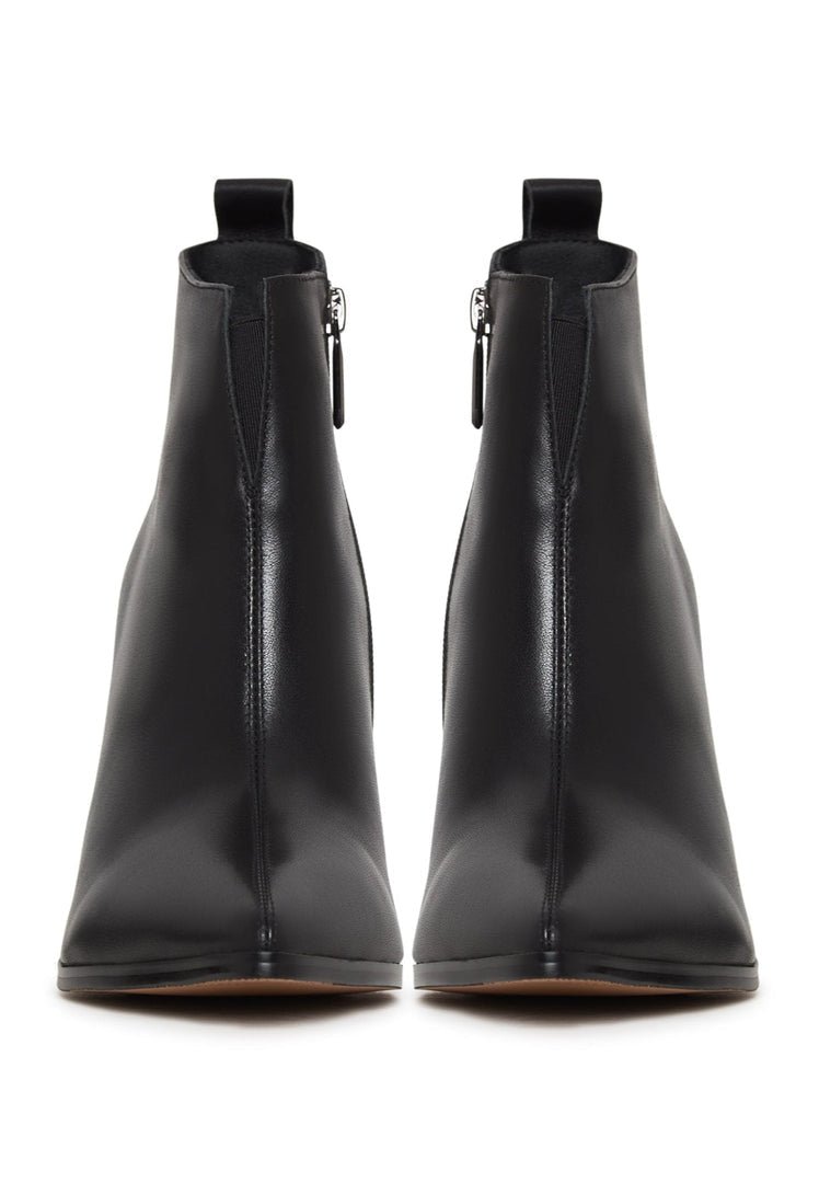 A pair of black pointed toe ankle boots with block heels, made of stylish leather.