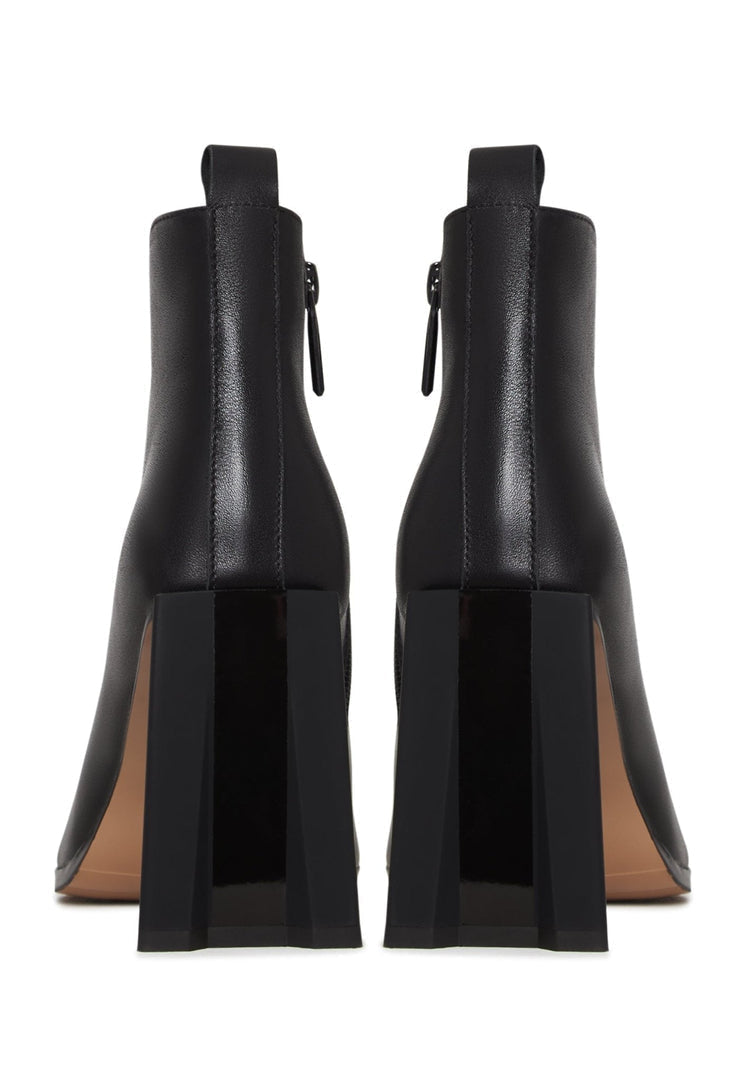 A stylish pair of black leather pointed toe ankle boots with block heels.