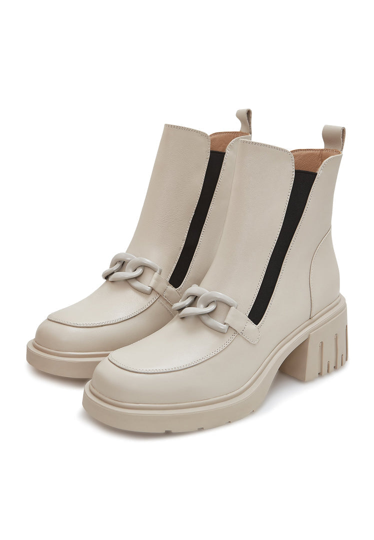 A pair of fashionable beige chunky heel ankle boots with chain detail, perfect for women's fashion.
