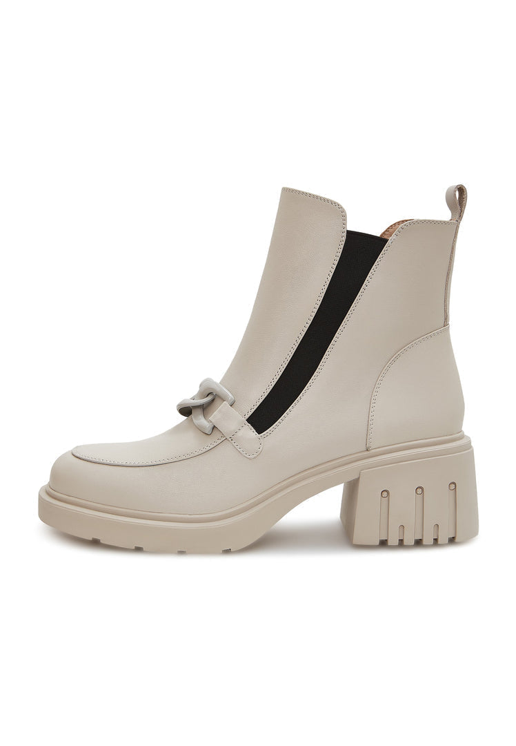 A stylish pair of women's chunky heel ankle boots in beige with trendy chain detail - perfect for a fashionable look.