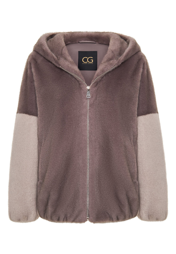 A fashionable brown faux fur jacket with a hood, the Reyna faux fur jacket, perfect for women's winter fashion.