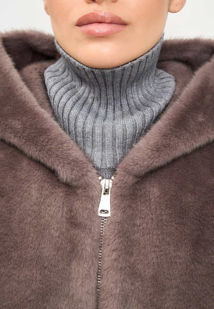 A trendy brown hooded faux fur jacket known as the Reyna, perfect for women's fashion enthusiasts.