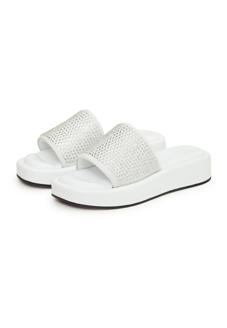 A trendy pair of white platform mule sandals with jewel embellishments, perfect for the fashion-forward woman looking for high heel platform shoes.