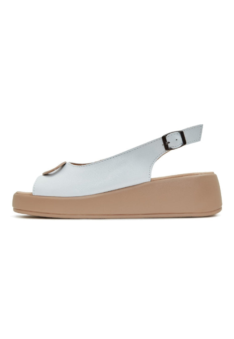 A stylish pair of white slip-on platform heel sandals, perfect for adding a touch of elegance to any outfit. Perfect for women looking for high heel sandals to elevate their footwear collection.