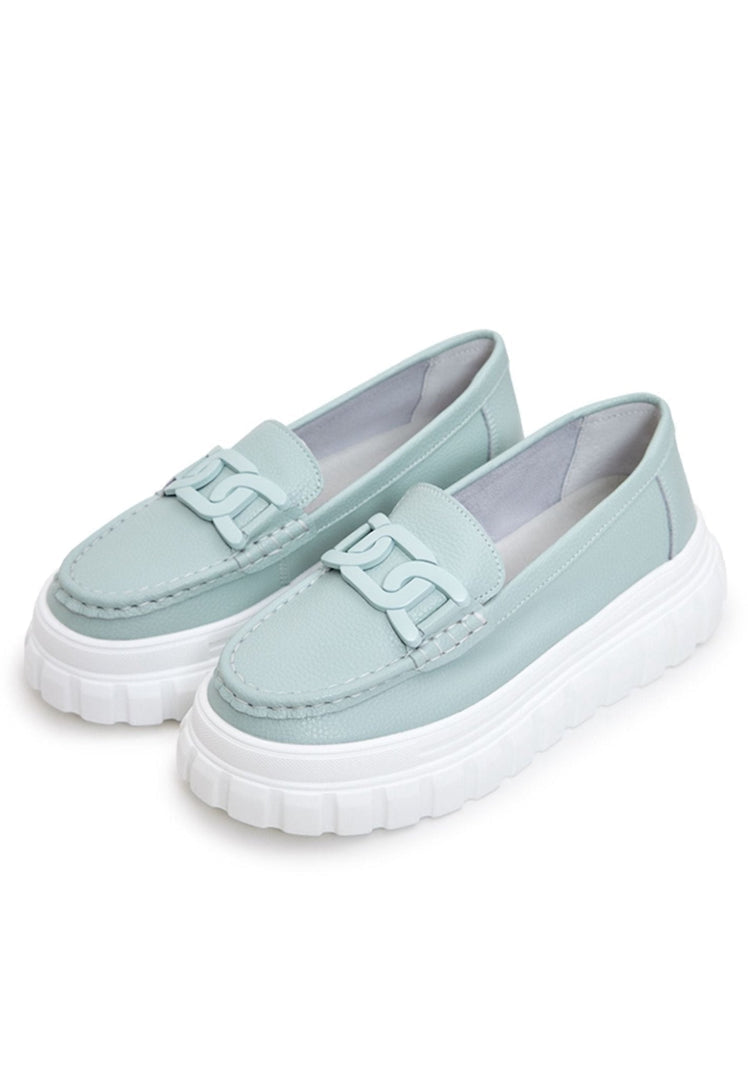 Stylish blue platform loafers crafted from leather, perfect for urban footwear enthusiasts.