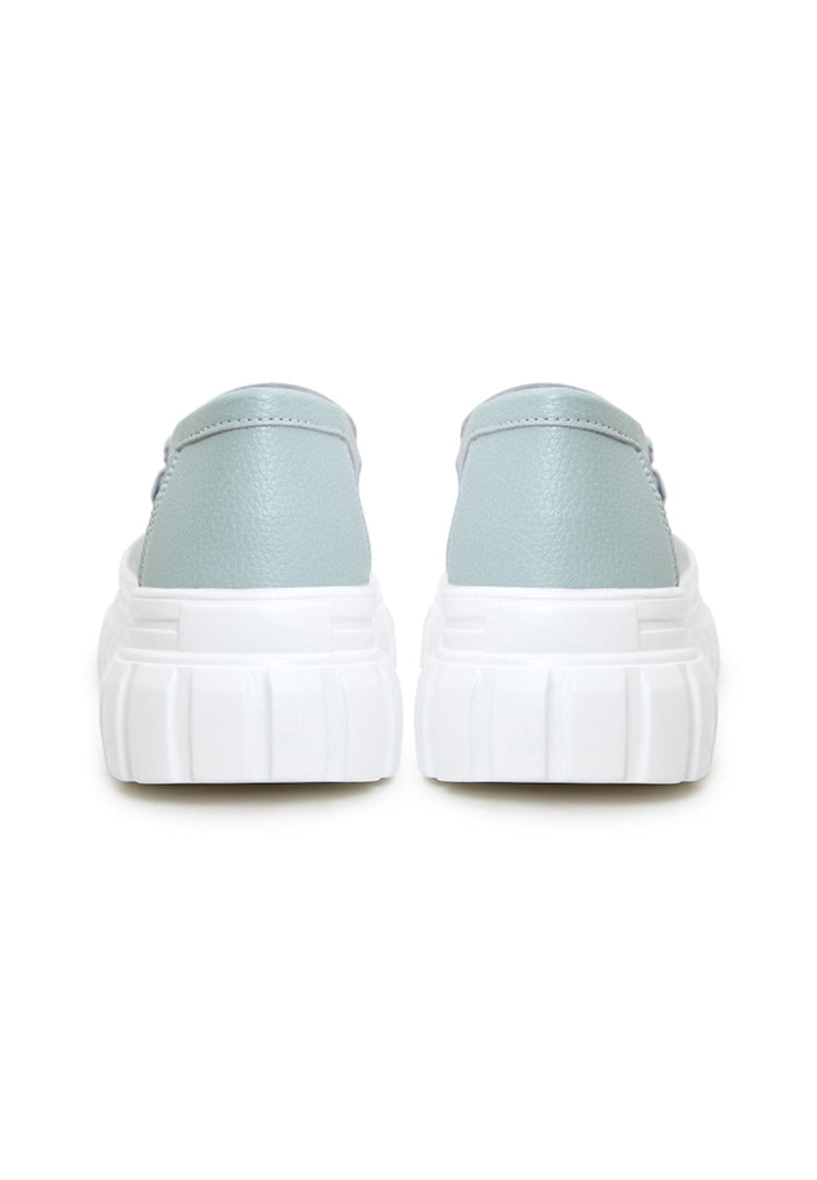 Stylish platform loafers in blue leather, perfect urban footwear for a chic look.