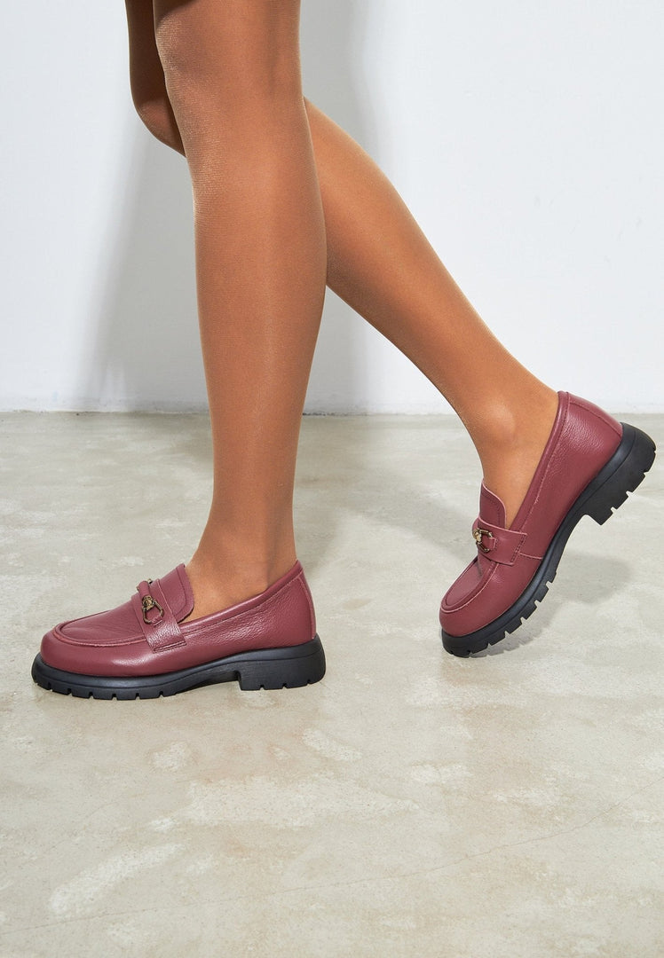A chic pair of burgundy leather platform loafers for women, featuring a stylish Bordeaux hue.