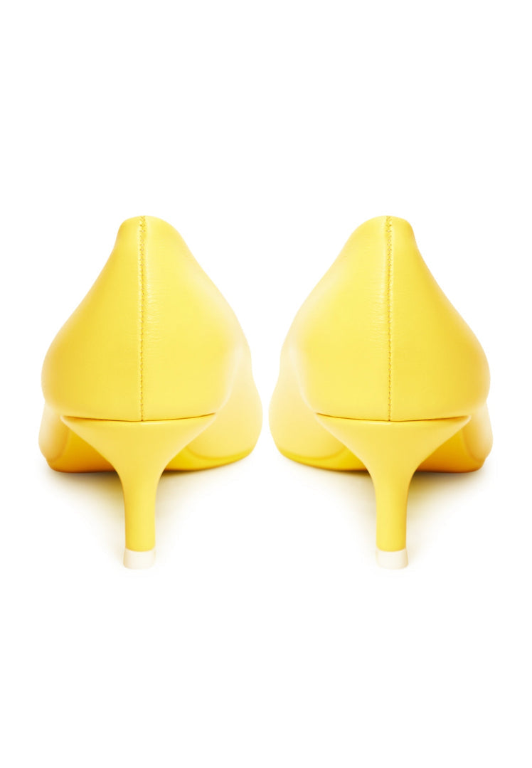 A pair of luxurious yellow pumps, the epitome of elegant footwear and designer heels for those seeking high-end shoes.