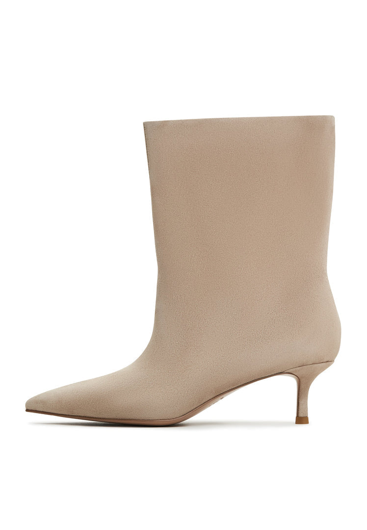 A stylish pair of classic ankle boots in beige, known as Regina beige boots, designed for women who love fashion and designer footwear.